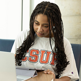 A female student studying on laptop