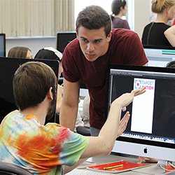 International graphic design students in Mac computer lab