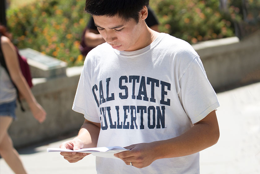 a student holding a document