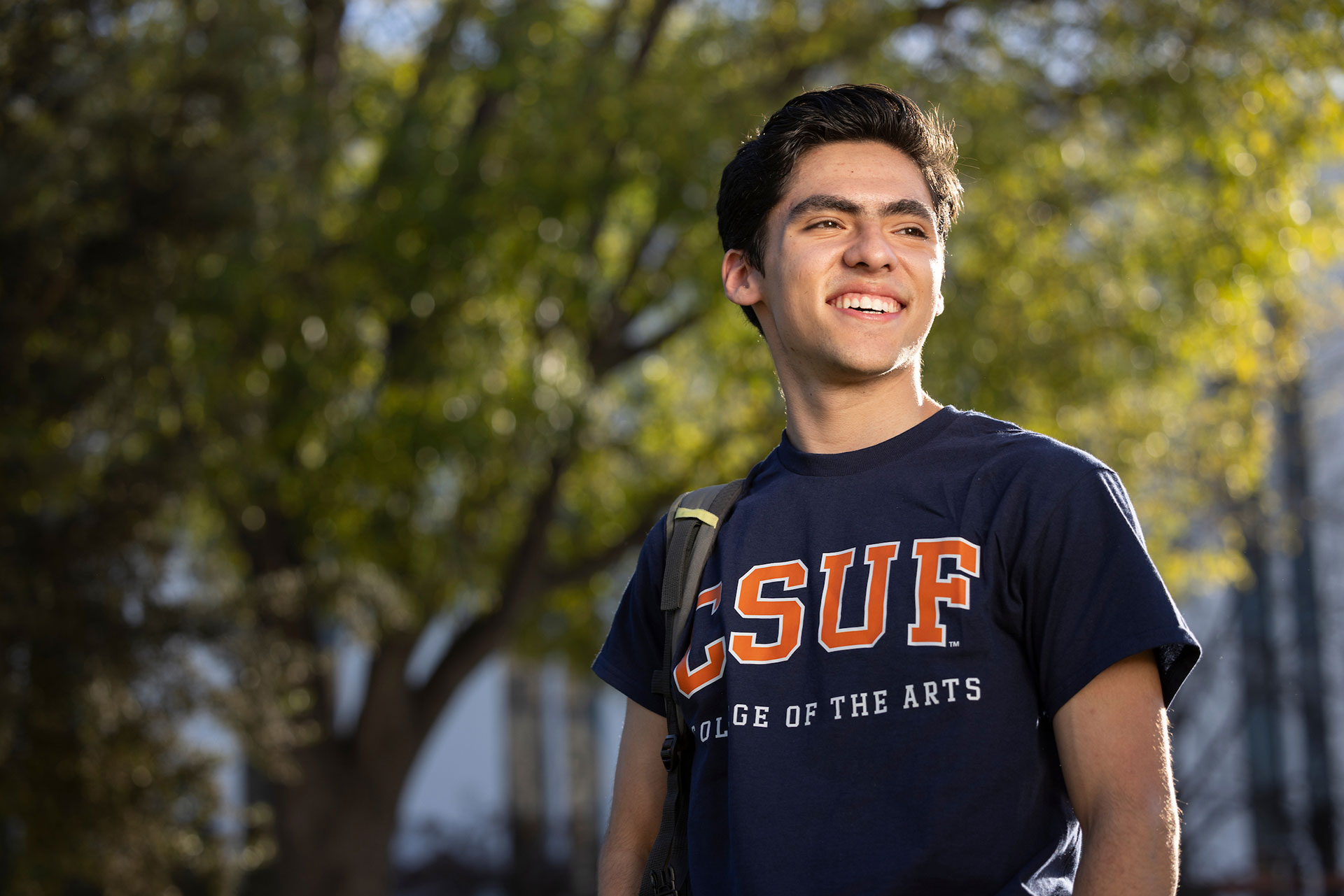 A male student walking on Campus.