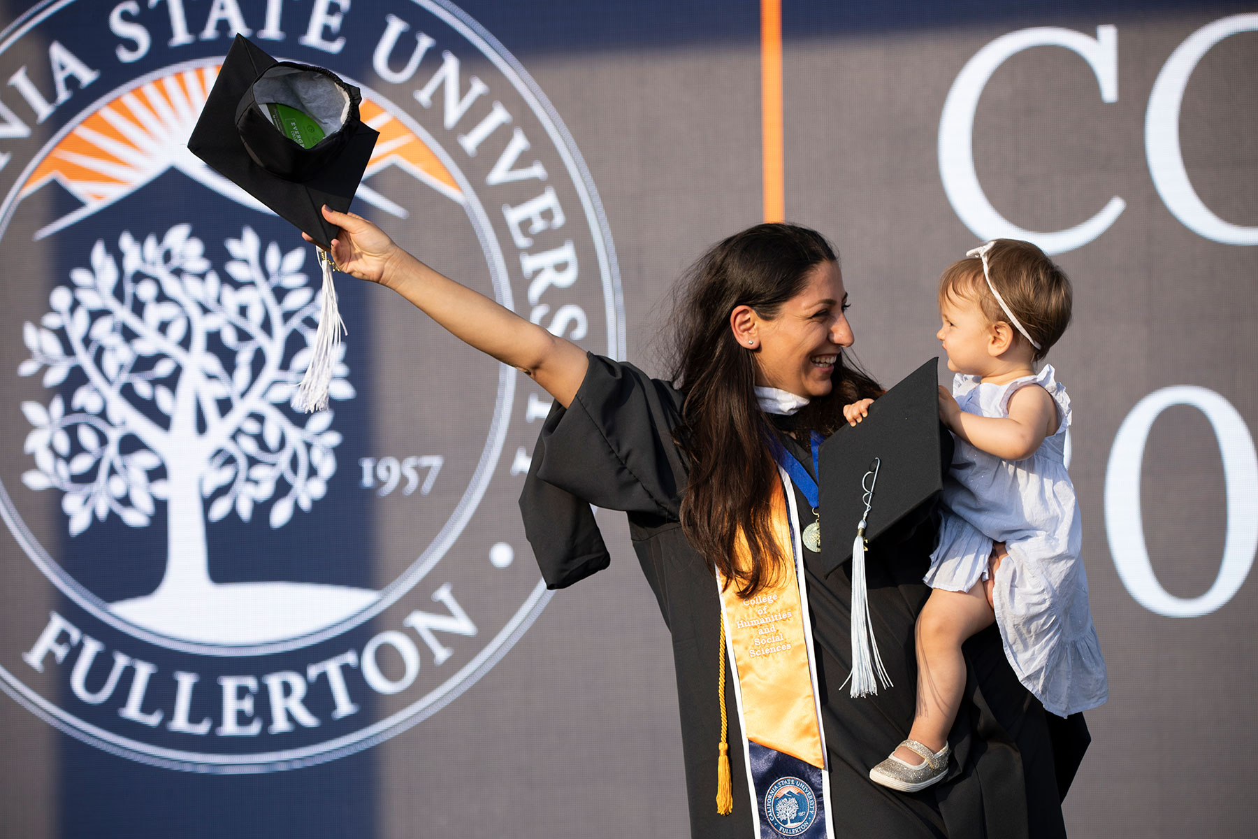 a happy grad with her daughter