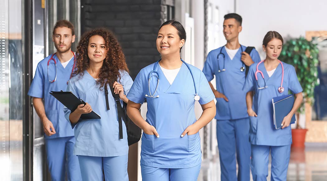 Group of diverse prehealth students walking