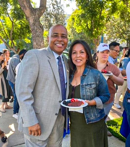 President Rochon and a University Extension team member at the Pancakes with the President event