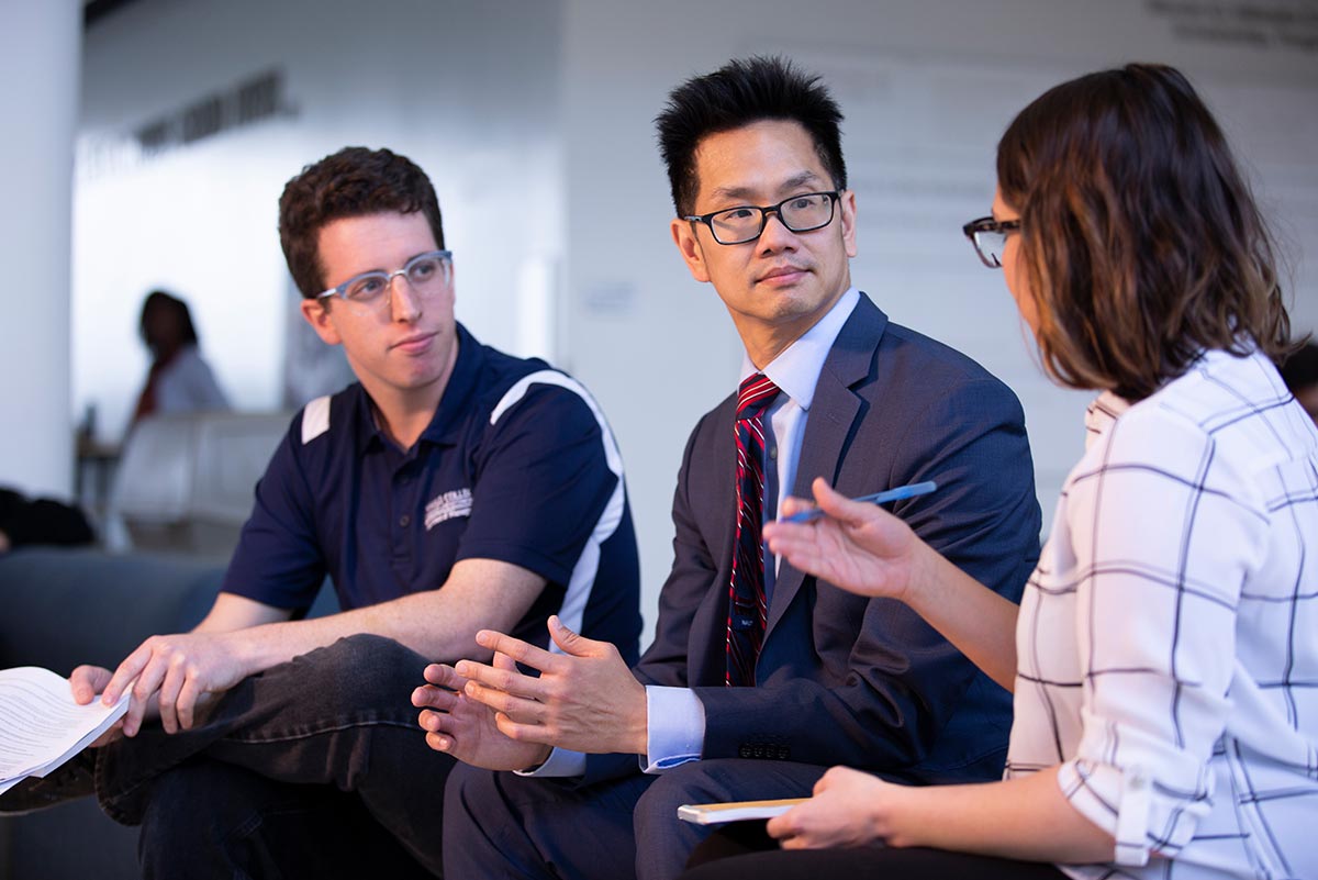 two people shake hands