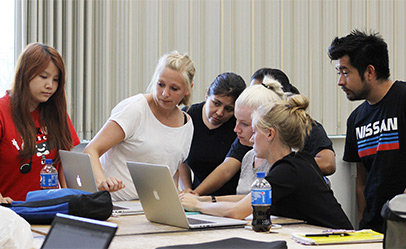 International graphic design students in Mac computer lab