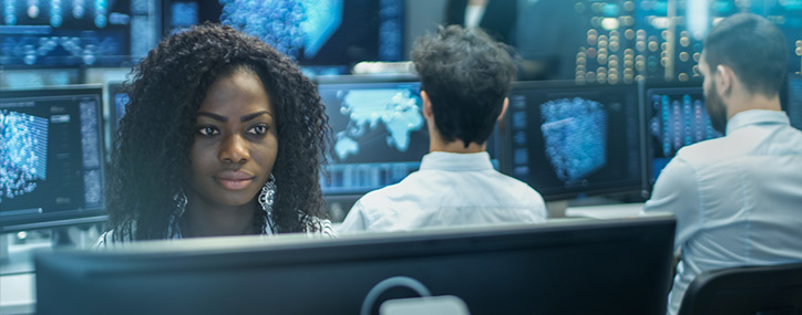 A lady looking at the monitor screen