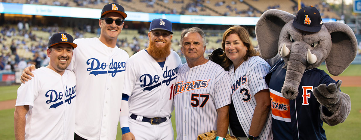 President Fram Virjee posing with the Dodgers